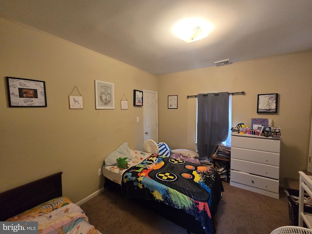 bedroom with dark carpet