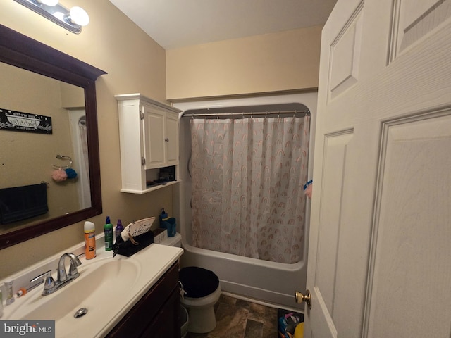 full bathroom featuring toilet, vanity, and shower / tub combo with curtain