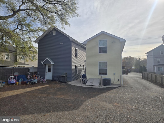 back of property featuring central AC unit