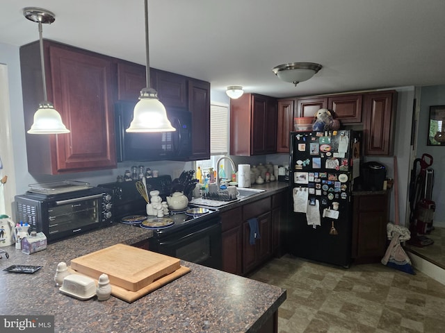 kitchen with hanging light fixtures, black appliances, and sink