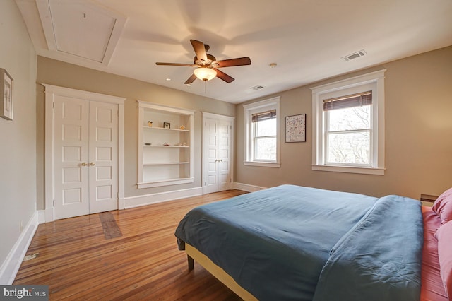 bedroom featuring ceiling fan and wood-type flooring