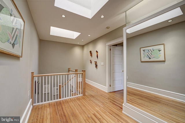 corridor with wood-type flooring