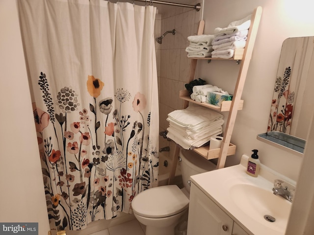 bathroom featuring toilet, vanity, and tile patterned floors