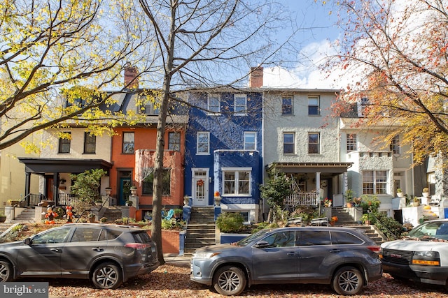 townhome / multi-family property with a porch