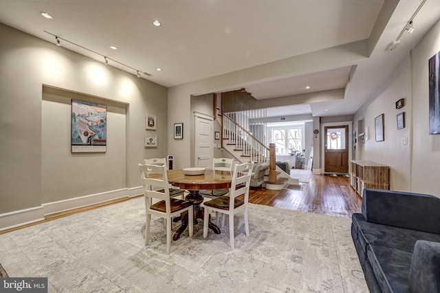 dining space with light hardwood / wood-style floors