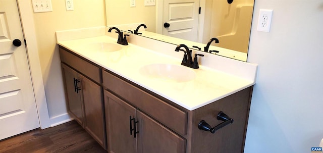 bathroom featuring hardwood / wood-style floors and vanity