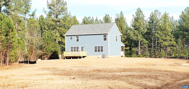 back of property with a wooden deck