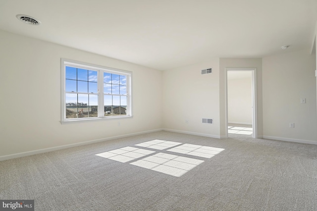 empty room with light colored carpet