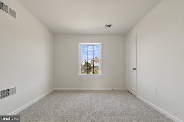 unfurnished room featuring carpet flooring