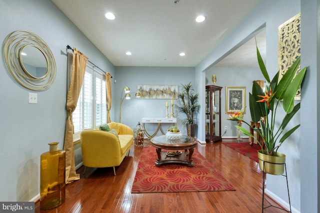 sitting room with hardwood / wood-style flooring