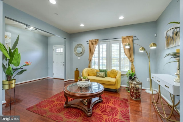 living area with hardwood / wood-style floors