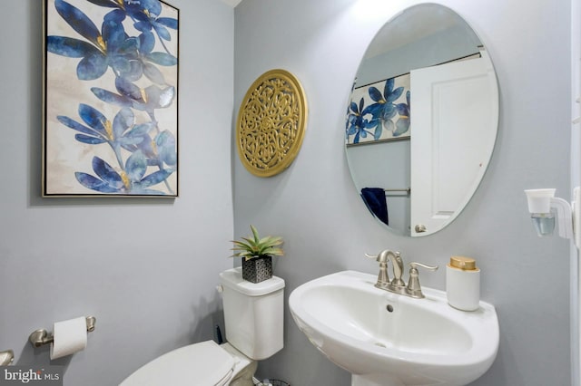 bathroom featuring sink and toilet