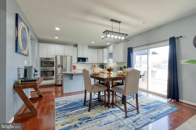 dining room featuring dark wood-type flooring