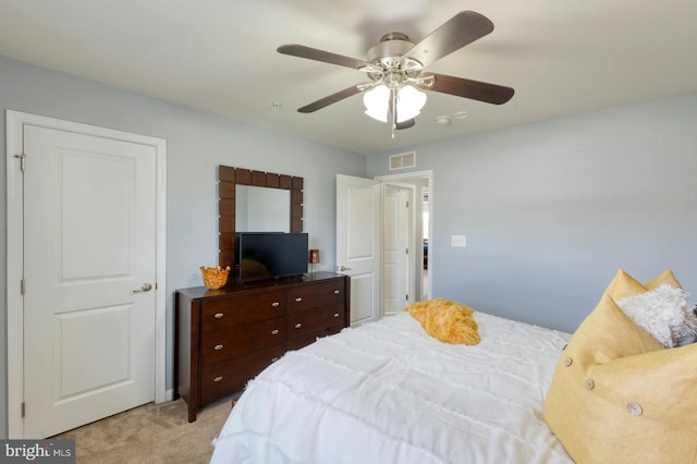 carpeted bedroom featuring ceiling fan