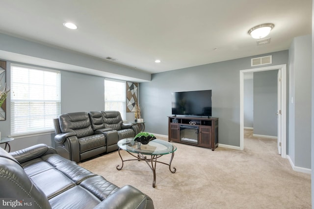 living room featuring light carpet