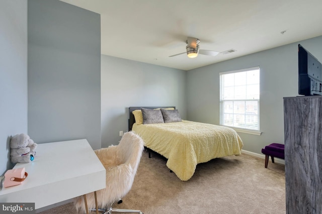 bedroom featuring ceiling fan and light colored carpet