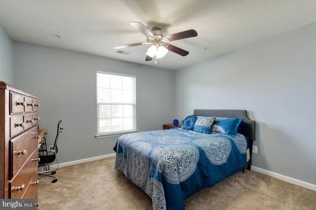 bedroom with light carpet and ceiling fan