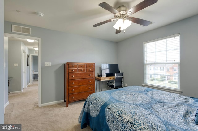 carpeted bedroom with ceiling fan