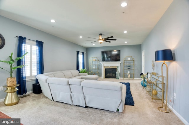 living room featuring ceiling fan and light carpet