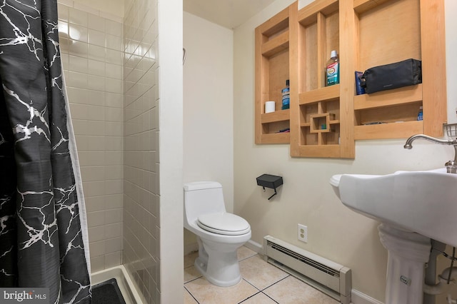 bathroom with toilet, a baseboard radiator, tile patterned floors, and walk in shower