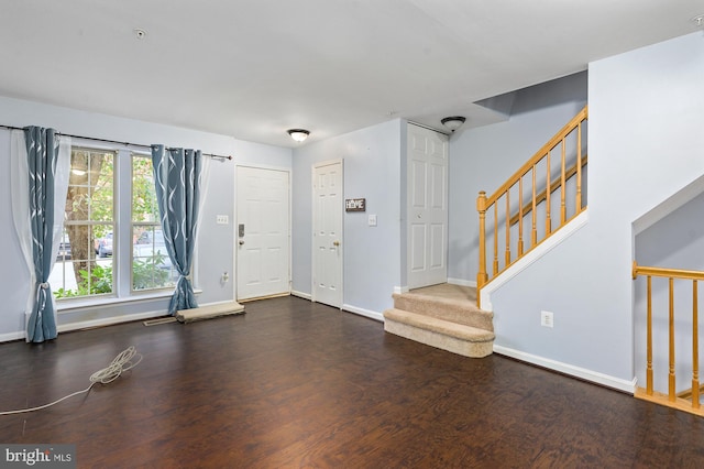 foyer featuring dark wood-type flooring