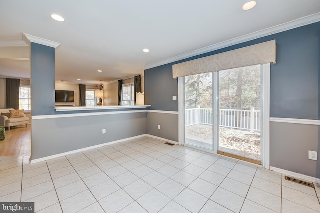 interior space featuring ornamental molding and a wealth of natural light