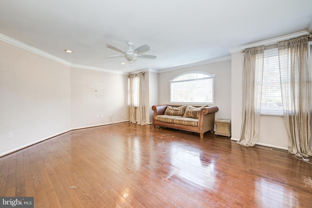 living room with ceiling fan, ornamental molding, and hardwood / wood-style flooring