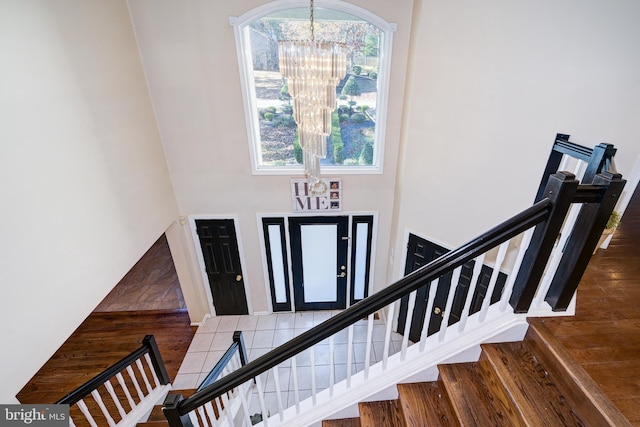 entrance foyer featuring dark hardwood / wood-style flooring and a notable chandelier