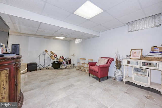 sitting room with a paneled ceiling