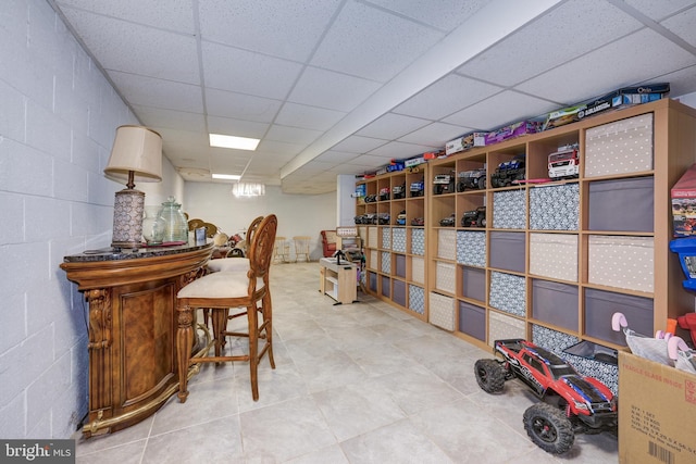 wine area featuring a drop ceiling