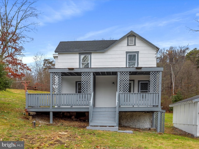 view of front of house featuring a front yard and a porch