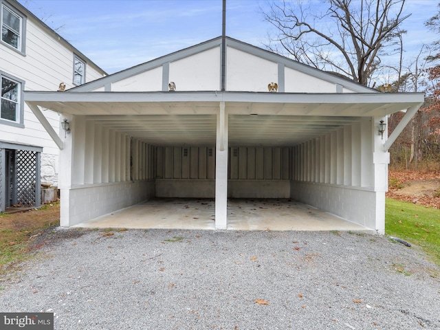 view of parking / parking lot featuring a carport