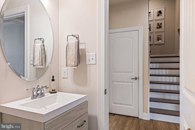 bathroom featuring vanity and hardwood / wood-style flooring