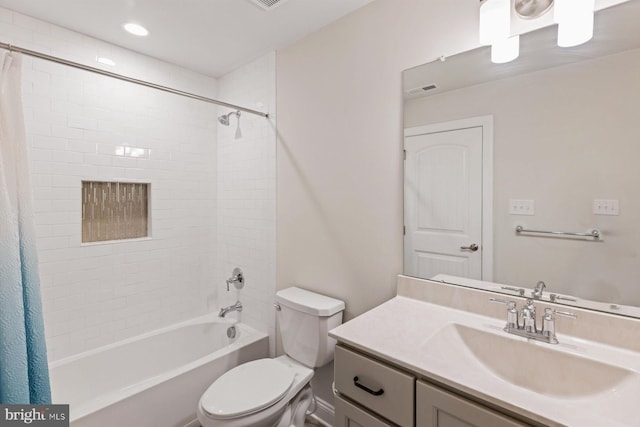 full bathroom with shower / tub combo with curtain, vanity, and toilet