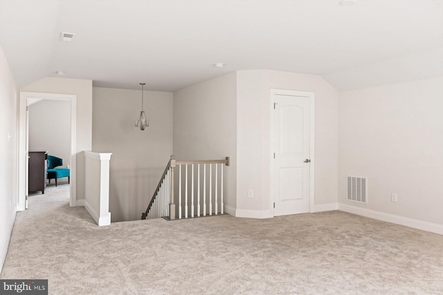 bonus room featuring light carpet and lofted ceiling