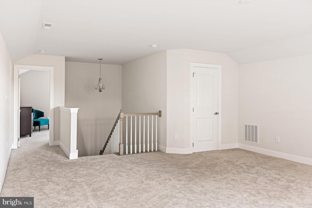 additional living space featuring vaulted ceiling, carpet floors, and baseboards