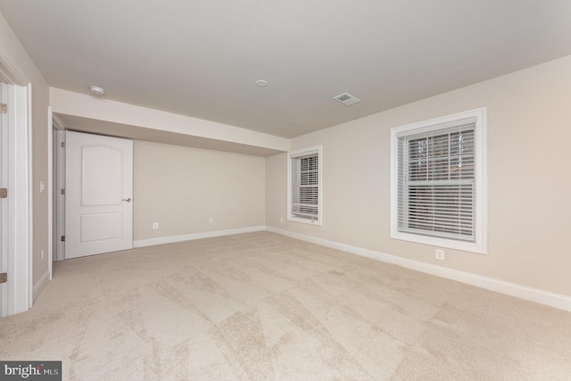 empty room featuring light colored carpet