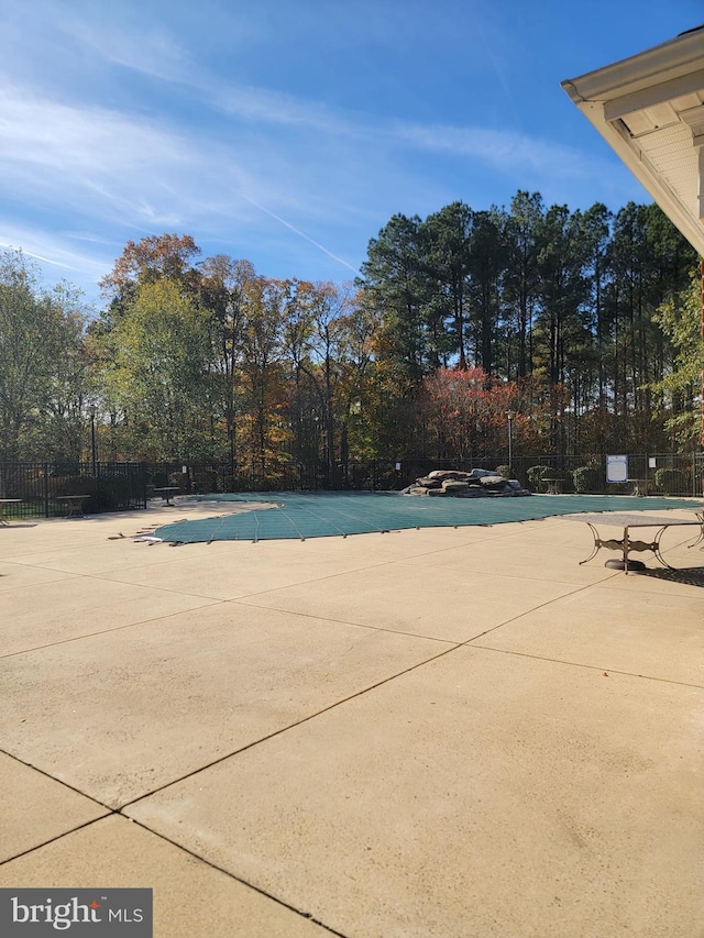 view of swimming pool with a patio area