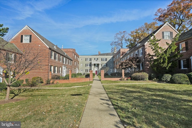 view of home's community featuring a yard