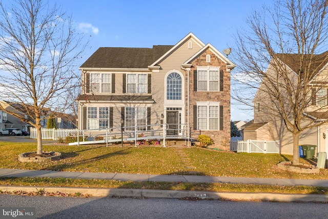 view of front of home with a front lawn