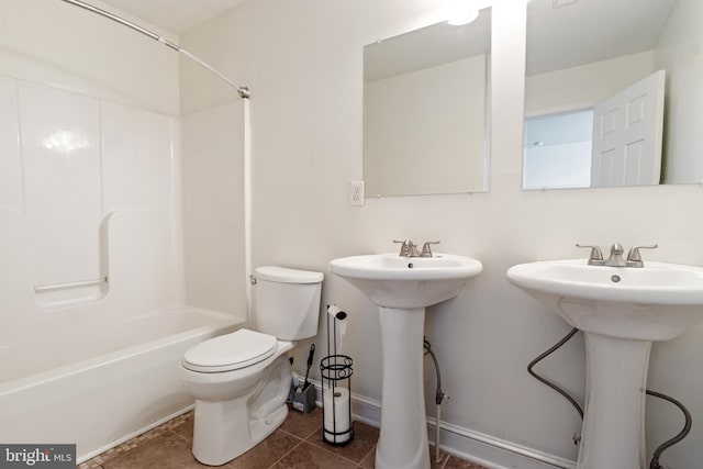 full bathroom with tile patterned flooring, sink, toilet, and  shower combination