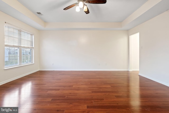 empty room featuring ceiling fan and dark hardwood / wood-style floors