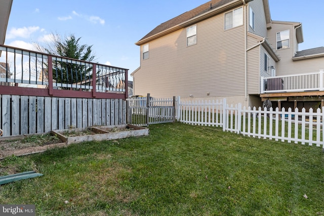 view of yard featuring a wooden deck