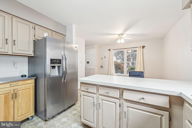 kitchen with stainless steel refrigerator with ice dispenser and ceiling fan