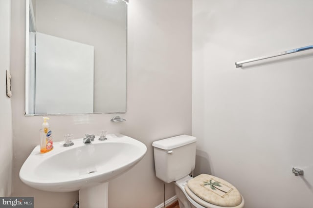 bathroom featuring sink and toilet