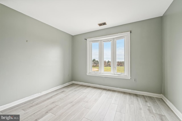 unfurnished room with light hardwood / wood-style floors