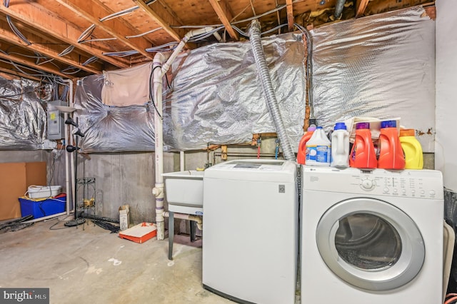 washroom featuring independent washer and dryer and electric panel