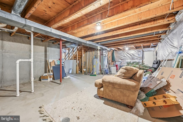 basement with refrigerator and gas water heater