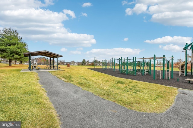 view of community featuring a playground and a lawn