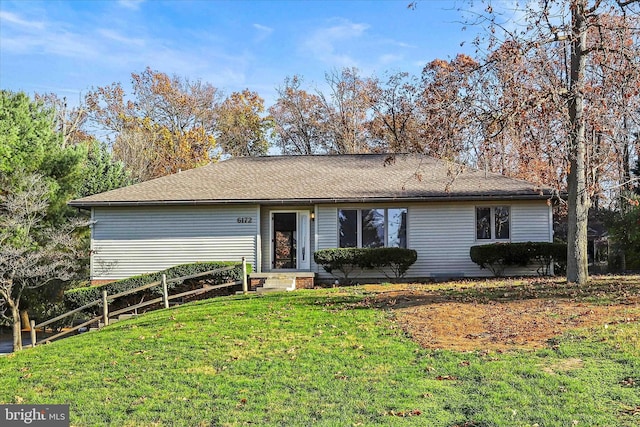 ranch-style house featuring a front lawn